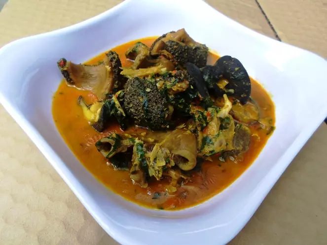 Ofe Owerri made with cocoyam, oha leaves, uziza, assorted meat, stockfish, red palm oil, crayfish and traditional spices - RoyalRoom Restaurant Lagos