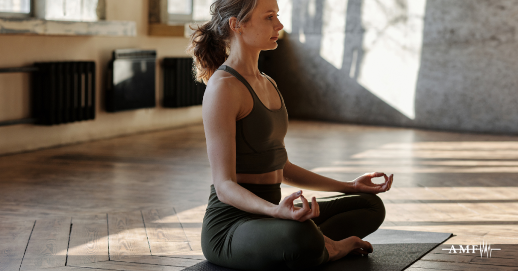 Woman meditating for stress relief and headache prevention