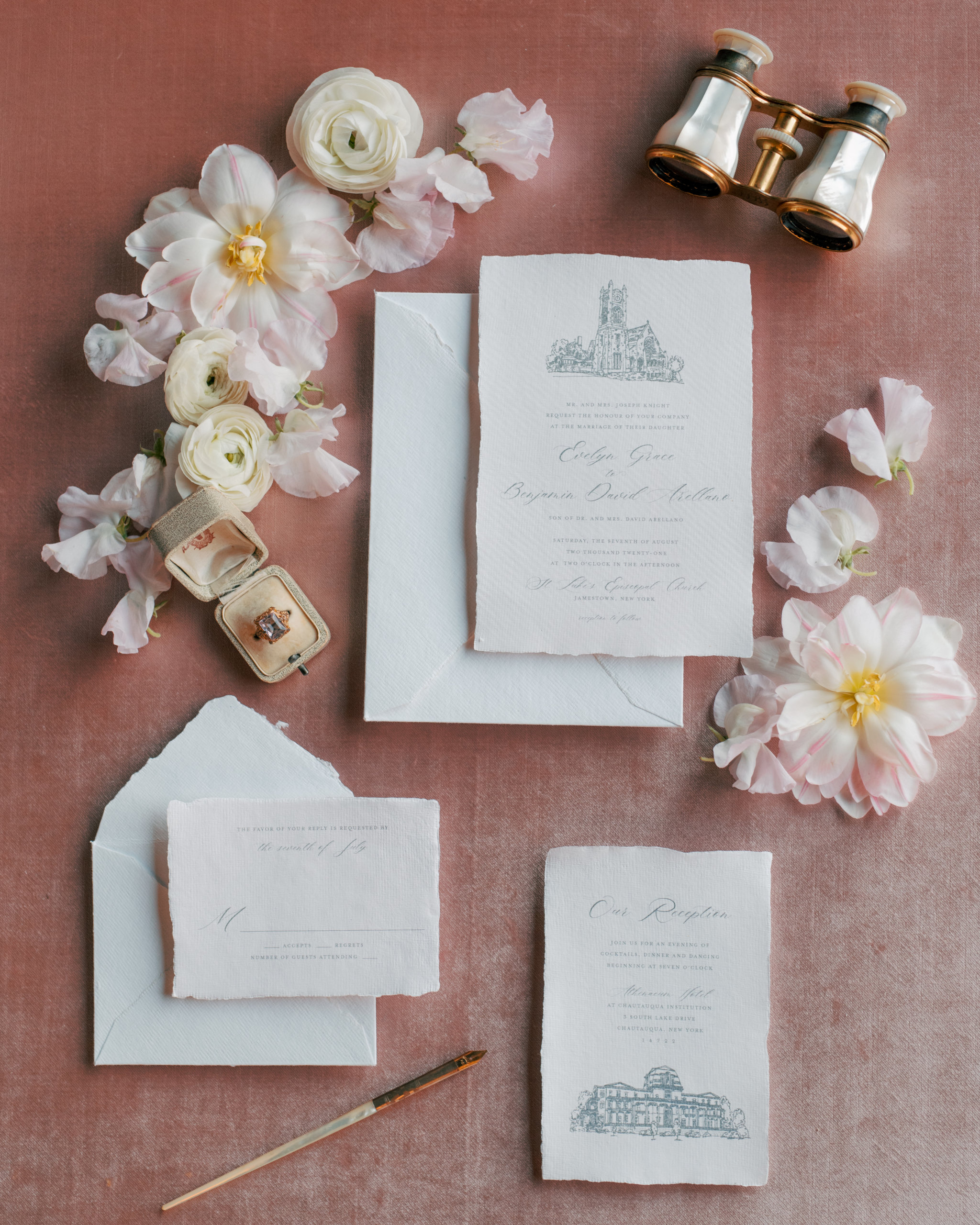 Elegant wedding stationery with white flowers and vintage binoculars