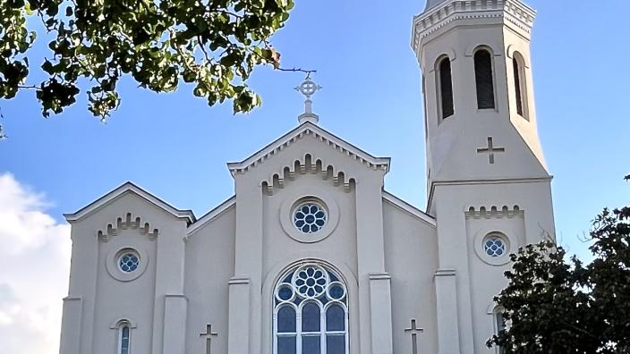 Website navigation menu showing Lithuanian church categories