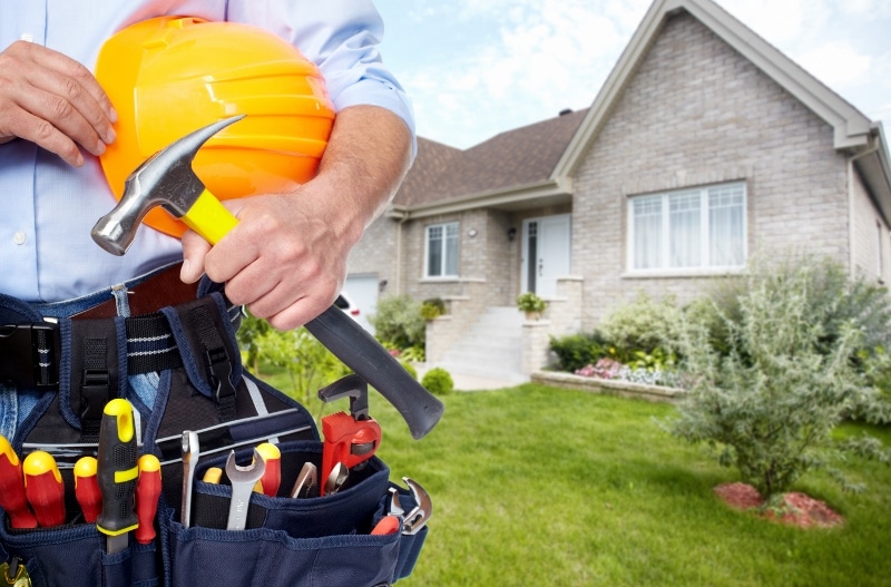 Professional handyman with tools ready for home repair