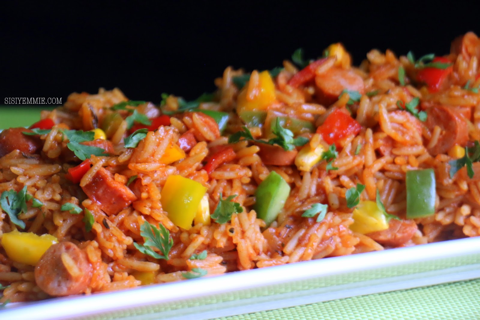 Jambalaya rice made with long grain rice, chicken, smoked sausage, tomatoes, green pepper, onions, paprika and creole seasoning - RoyalRoom Restaurant Lagos