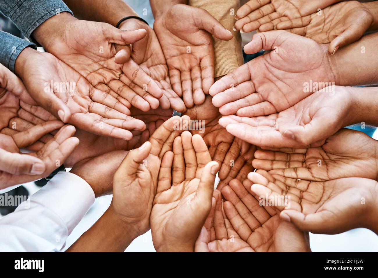 Diverse hands joined together in community support