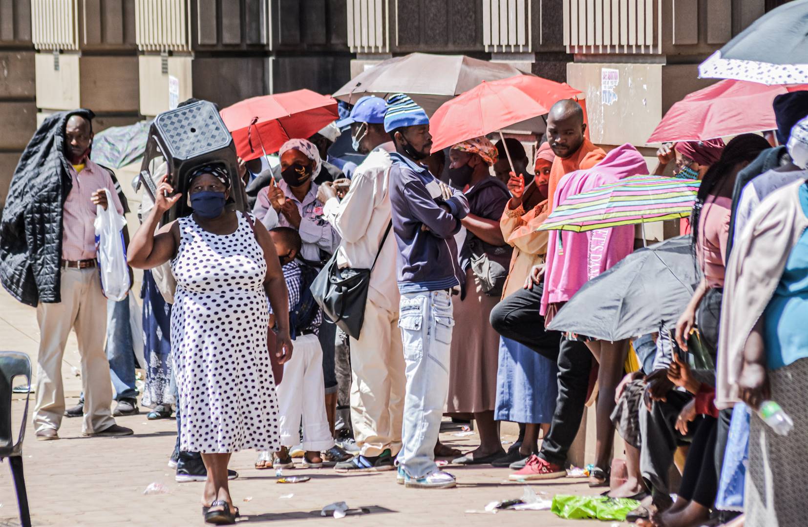 Unemployed people waiting in line in South Africa