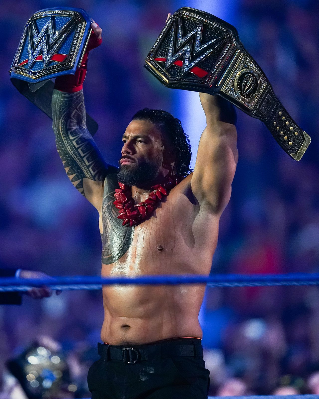 Roman Reigns with both titles
