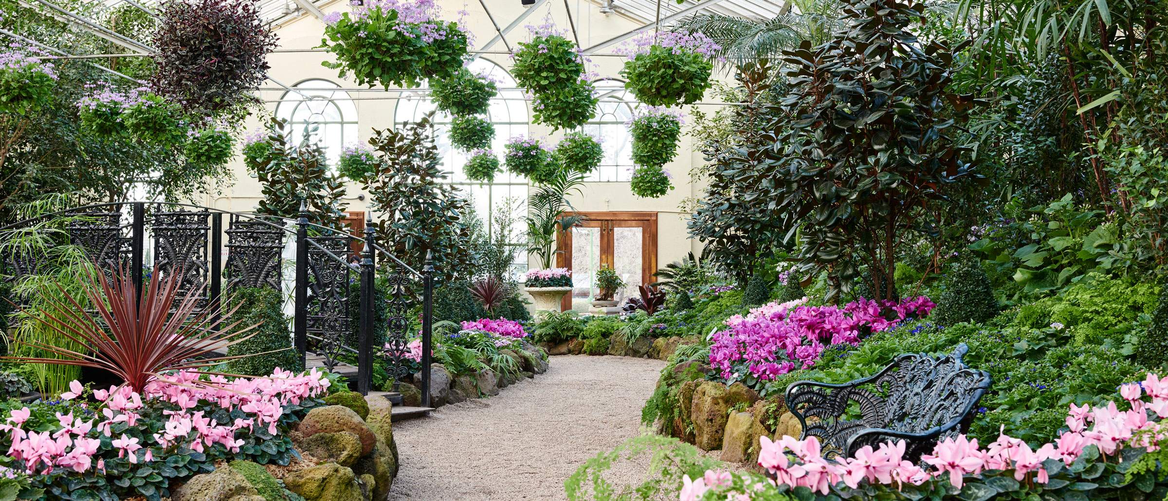 Fitzroy Gardens Conservatory interior showing colourful flower displays