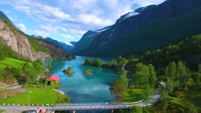 Fjord Lake Terrain A stunning fjord landscape with turquoise waters nestled between steep mountain slopes, where glacial erosion has carved a dramatic U-shaped valley now filled by pristine waters.
