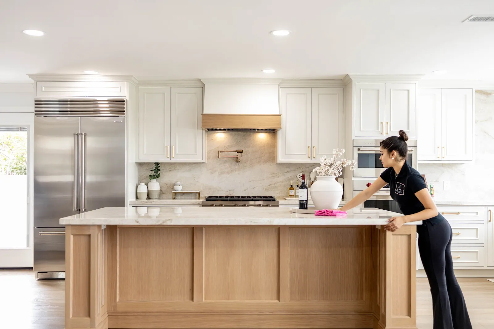 Professional cleaner in modern kitchen