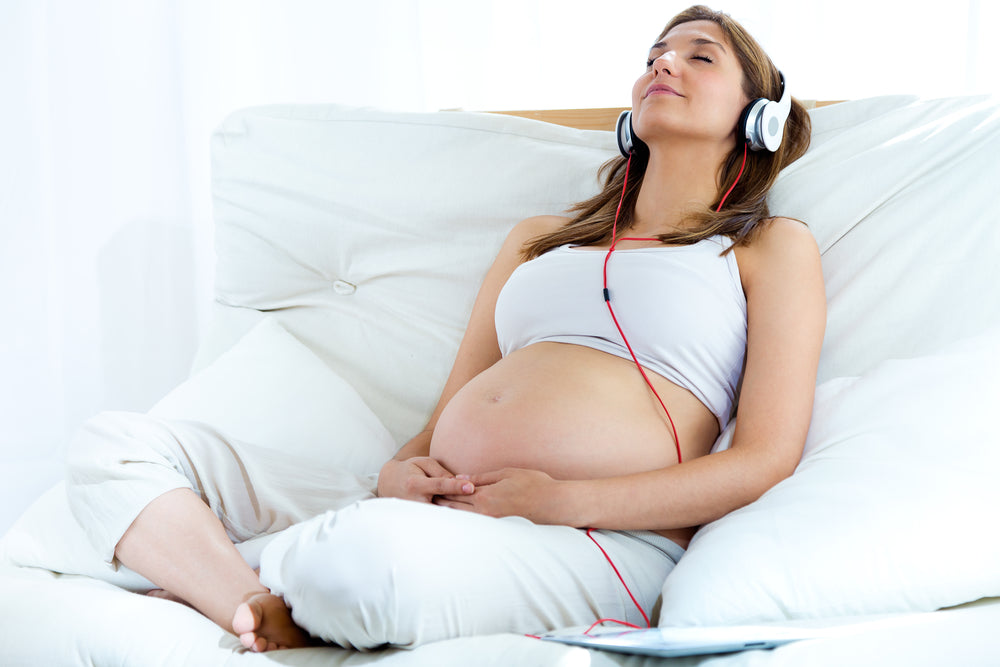 Pregnant woman relaxing and managing stress during pregnancy