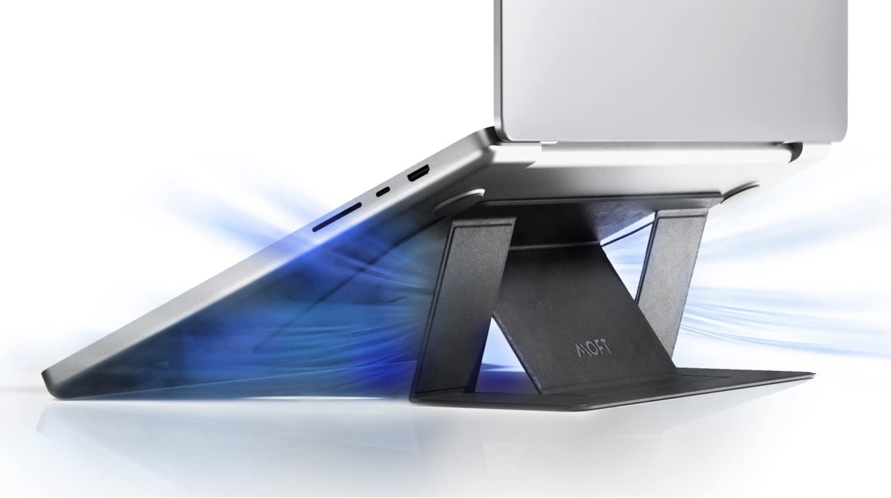 Laptop elevated on a slim cooling stand showing improved airflow underneath the device