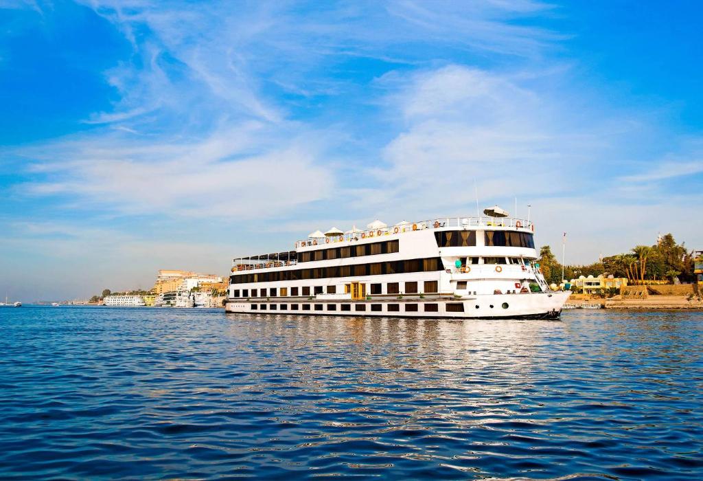 Luxury Nile cruise ship sailing on the Egyptian Nile River between Luxor and Aswan