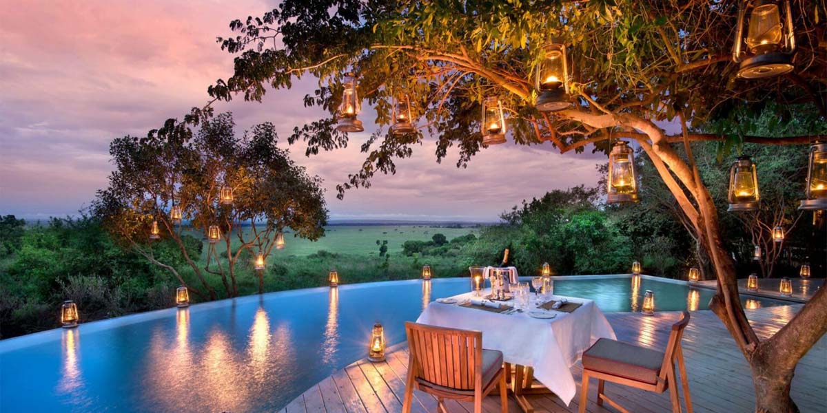 Luxury safari camp infinity pool sunset Kenya
