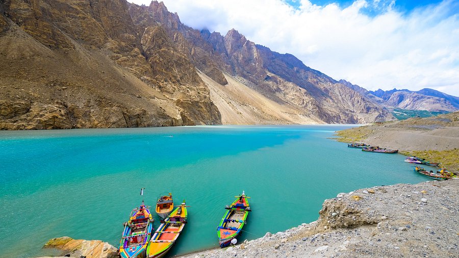 Adventure GB Hunza Attabad Lake tour with colorful boats and turquoise water