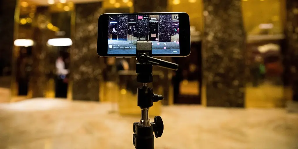 Smartphone mounted on tripod for Facebook Live broadcast