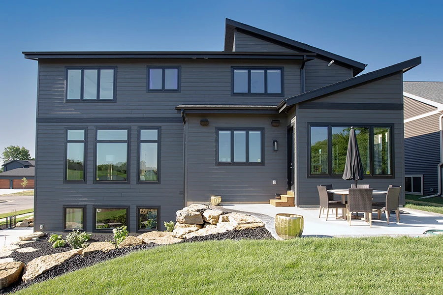 Modern gray siding home with patio