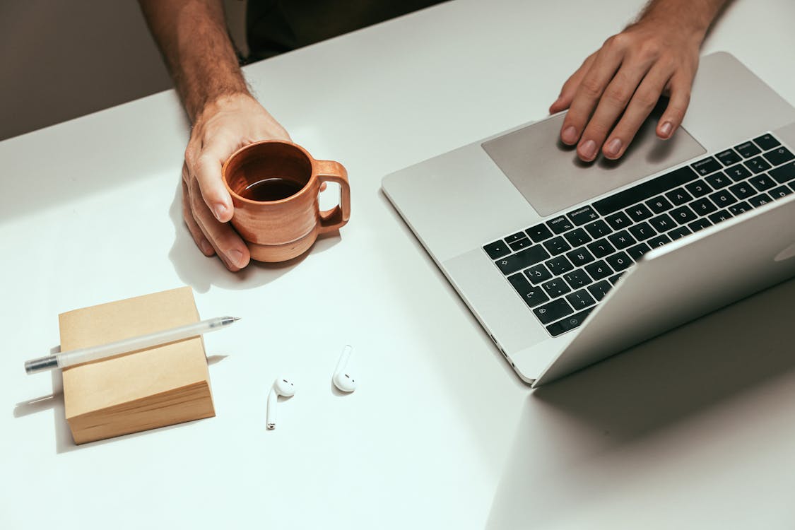 Minimalist workspace with laptop and coffee cup