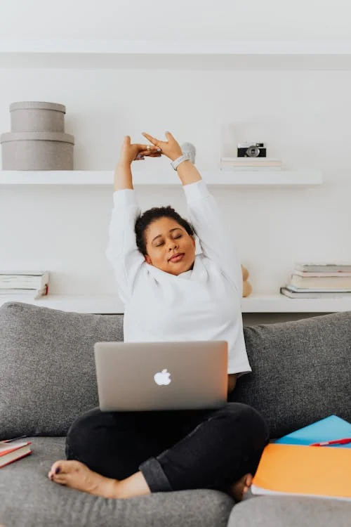 Remote worker stretching at home office