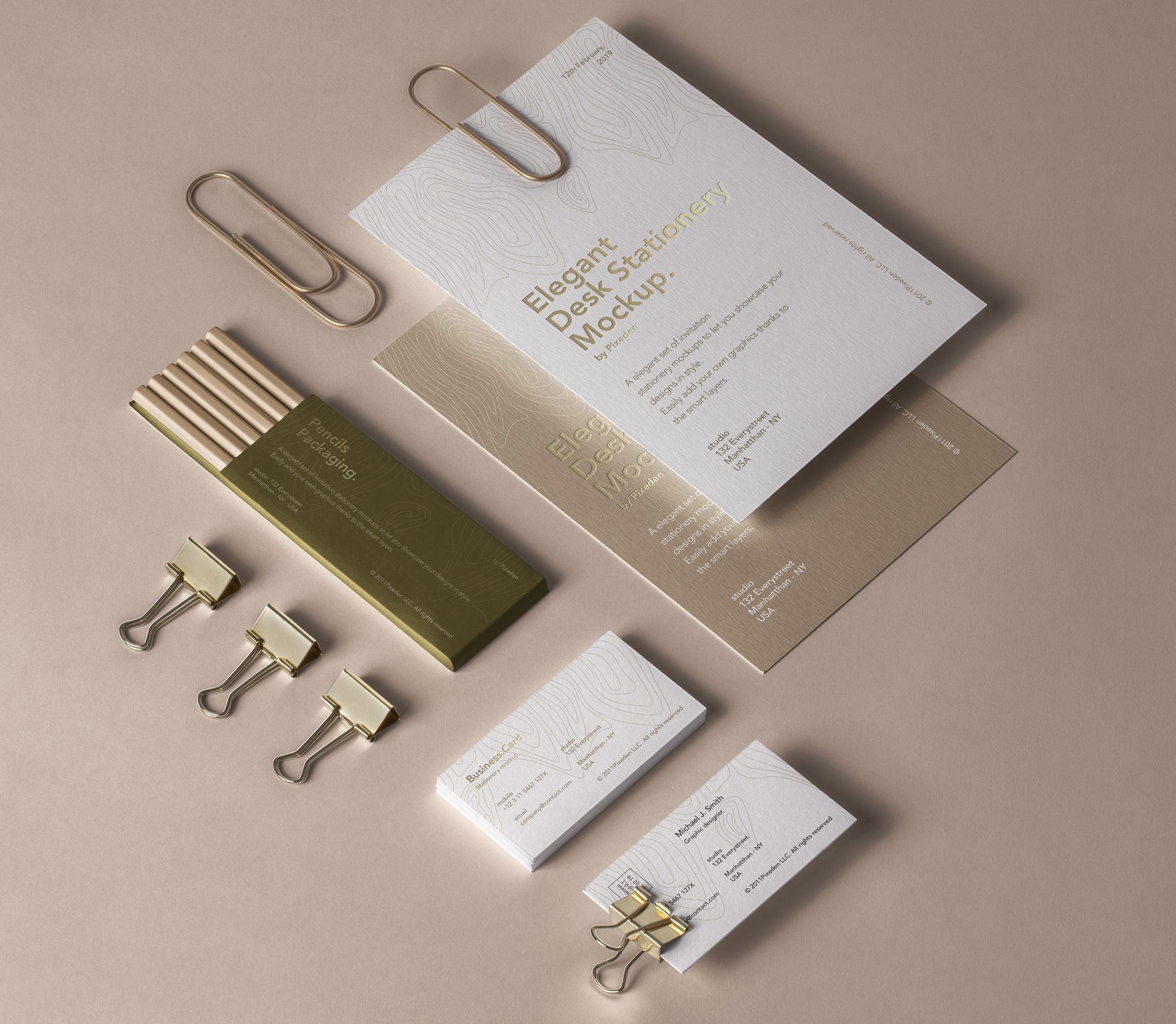 Elegant desk stationery mockup with gold paper clips and business cards