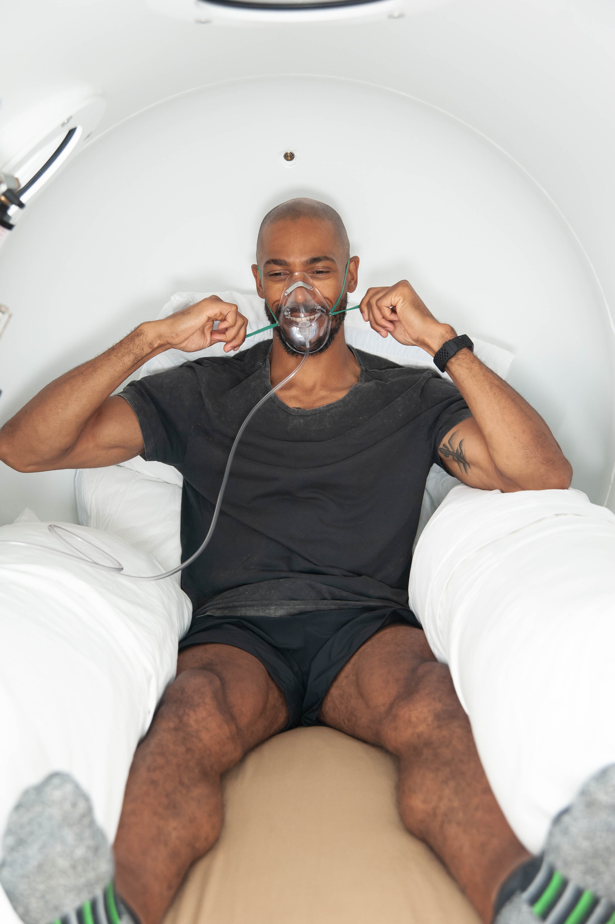 Athlete sleeping in recovery chamber