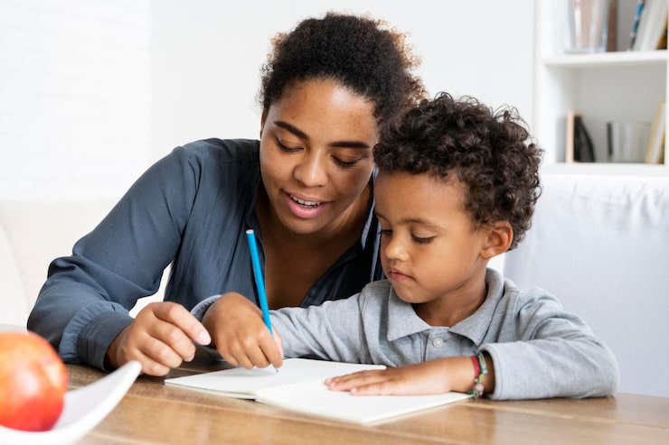 Parent helping child with homework smiling