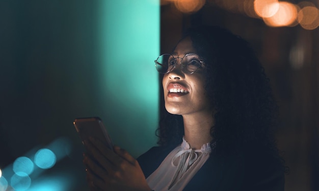 African entrepreneur on phone planning social media content