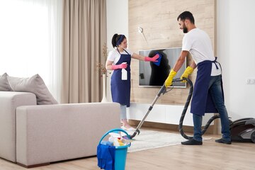 Professional cleaning team in modern home