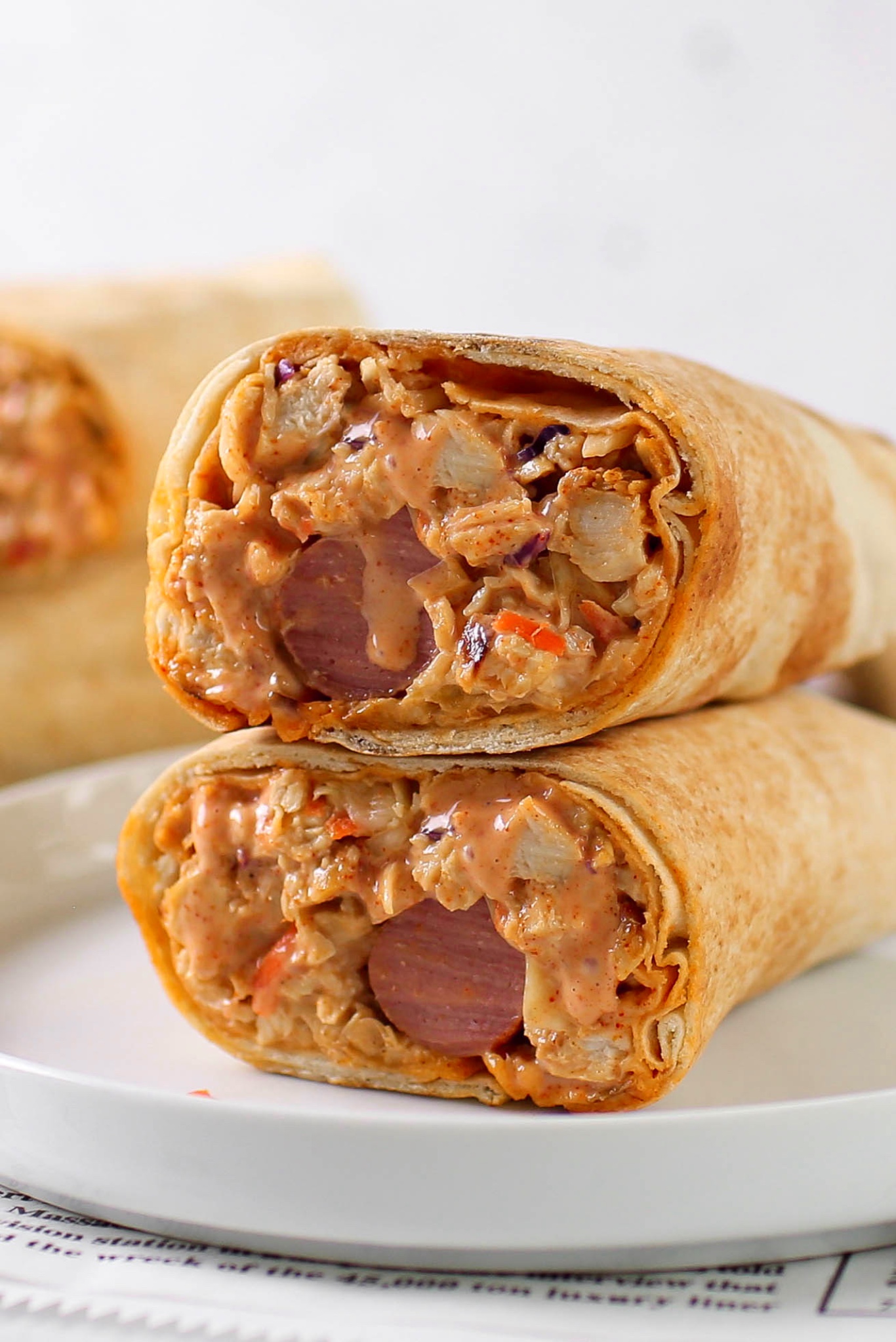 Chicken shawarma made with flatbread, grilled chicken strips, coleslaw, cucumber, tomatoes, garlic sauce and chilli sauce - RoyalRoom Restaurant Lagos