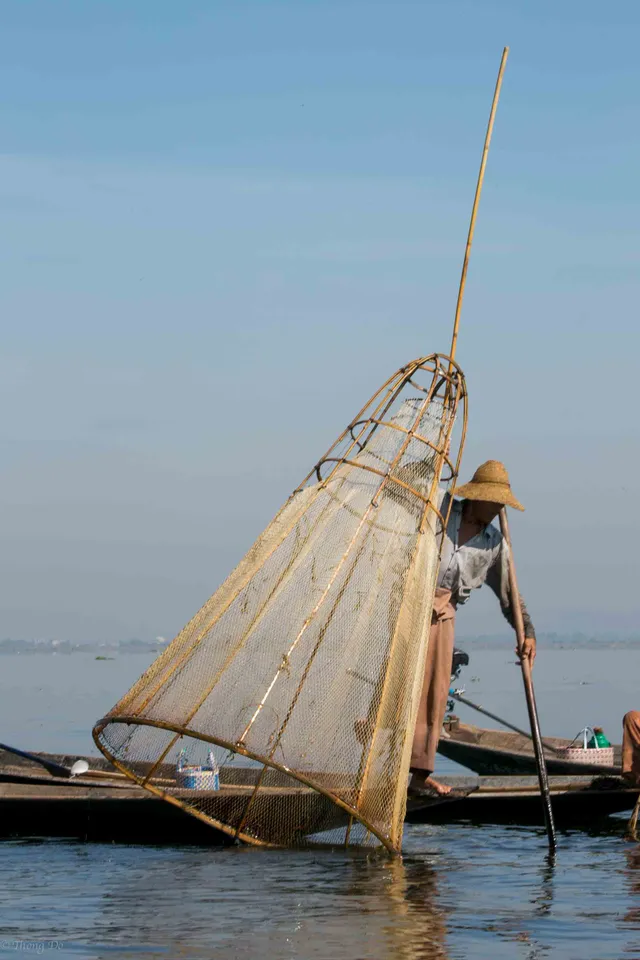 Inle Lake floating gardens and leg rowing fishermen in Myanmar