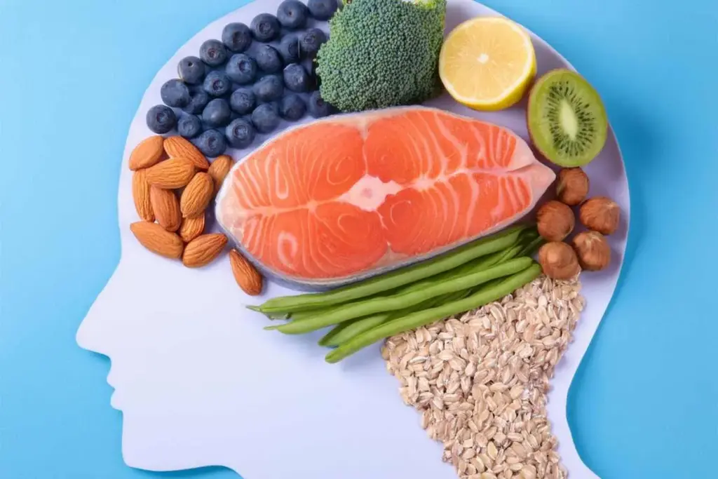 Salmon and brain-healthy foods arranged in a brain shape showing omega-3 rich nutrition