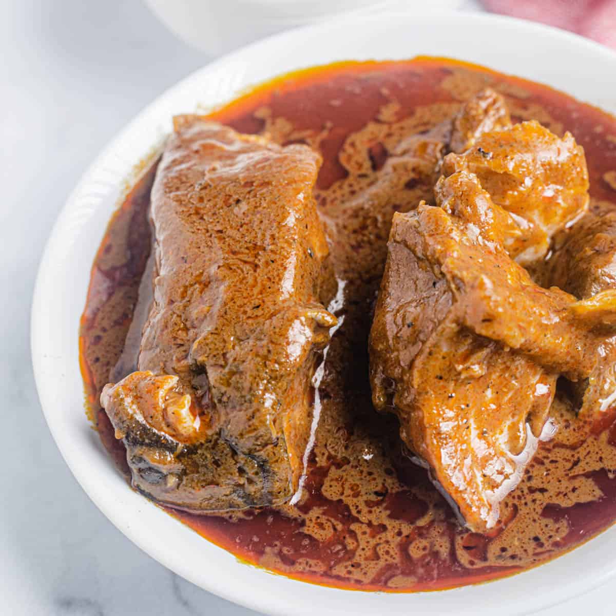 Banga soup made with palm nut extract, catfish, banga spices, oburunbebe stick, onions, crayfish and scotch bonnet pepper - RoyalRoom Restaurant Lagos