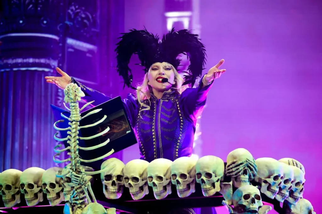 Lady Gaga in gothic Victorian opera singer costume on stage
