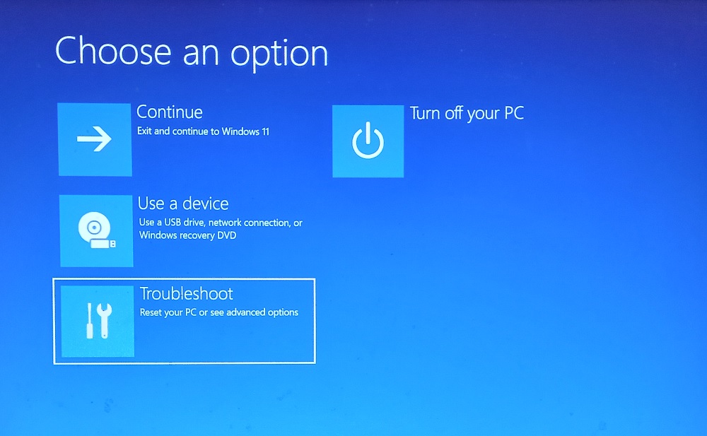 Windows Update stuck screen showing troubleshooting options and recovery environment