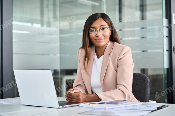 Professional woman at her desk in a US corporate office