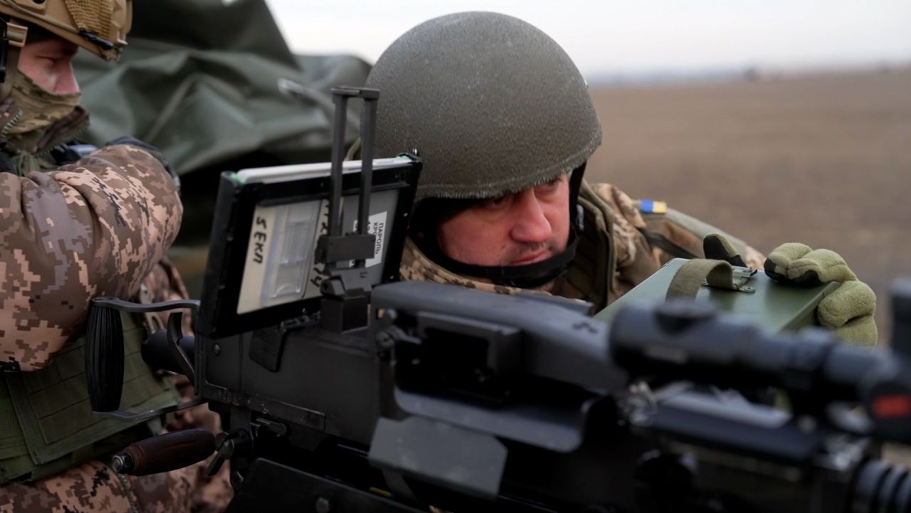 Ukrainian military anti-aircraft defense team with tablet