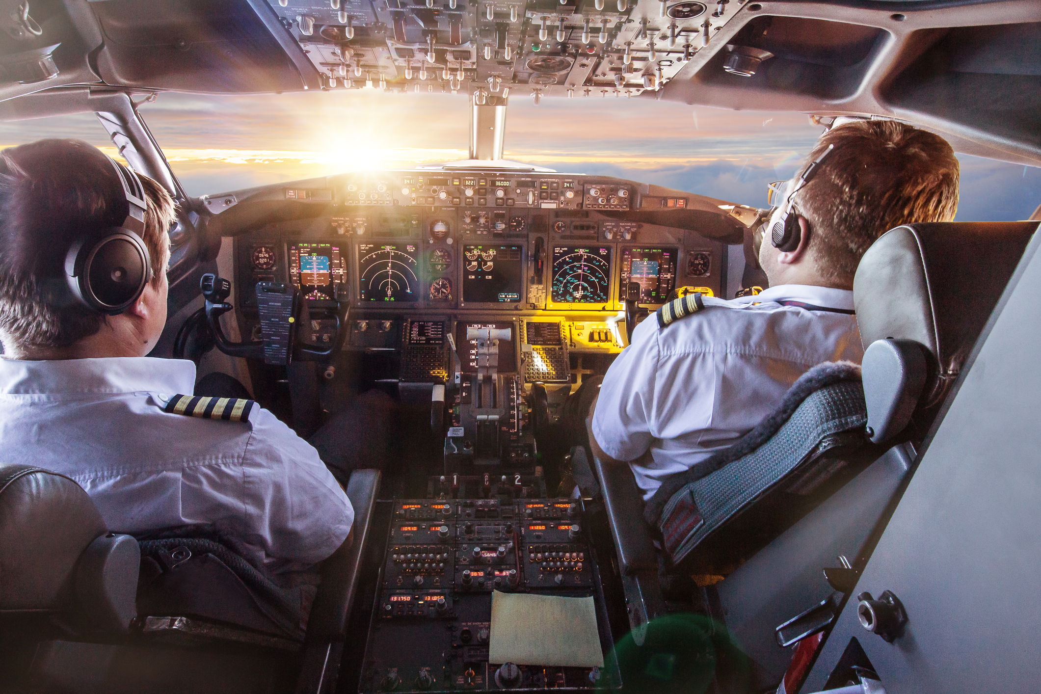 Pilots in the cockpit during a flight with commercial airplane. - Monmouth Jet Center