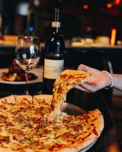 Wood fired pizza with wine at Wine and Bottle Nairobi restaurant