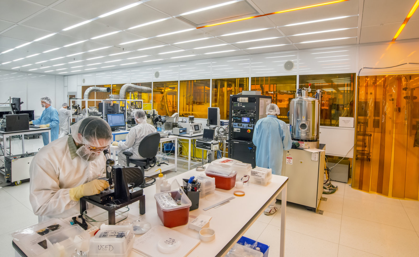 Scientists working in a quantum physics laboratory clean room