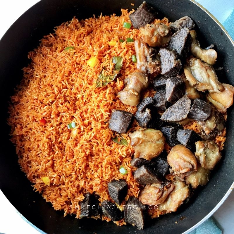 Asun rice made with smoky jollof rice, grilled goat meat, scotch bonnet pepper, onions, thyme and mixed spices - RoyalRoom Restaurant Lagos