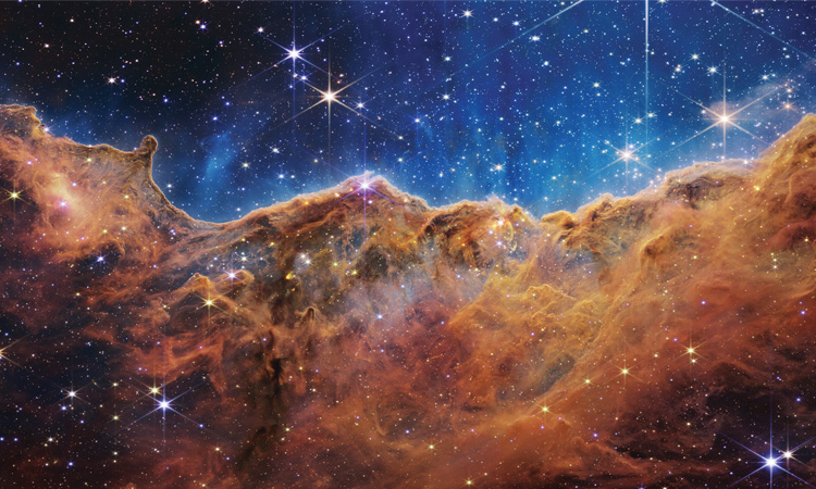 Artist's concept of James Webb Space Telescope observing cosmic phenomena