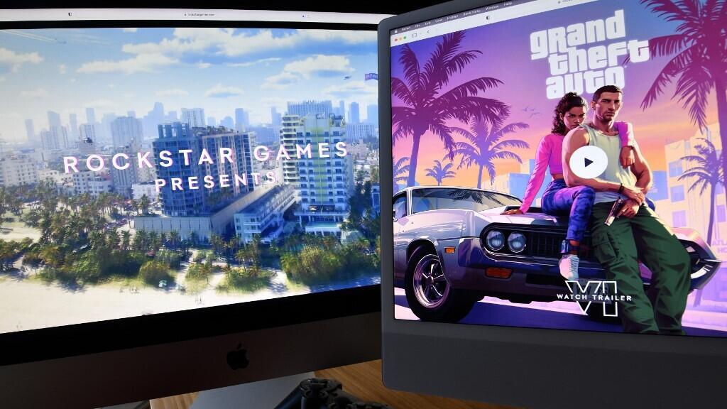 GTA 6 trailer playing on dual monitors showing Vice City gameplay footage