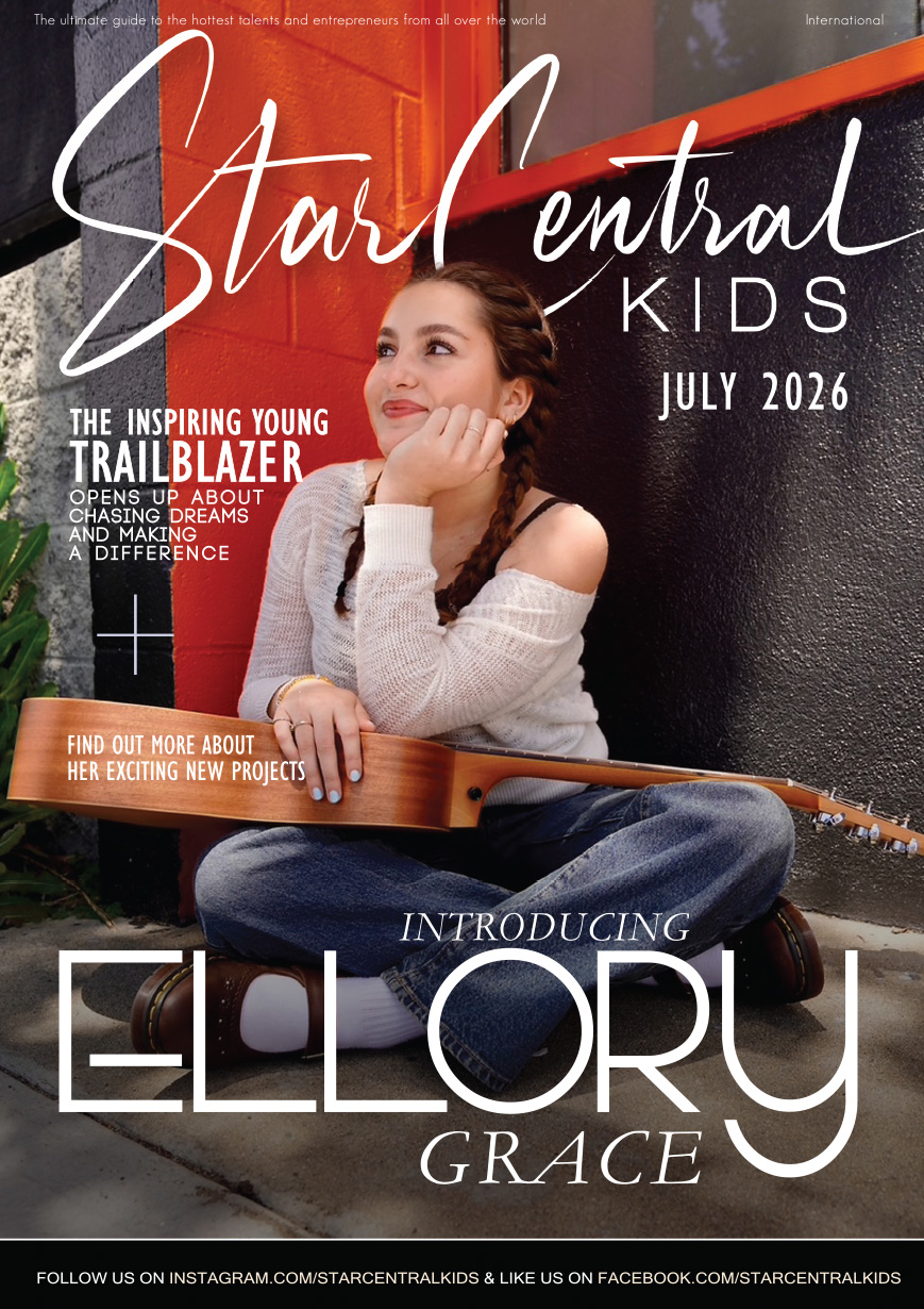 Ellory Grace featured on the cover of StarCentral Kids Magazine, July 2026 — sitting with her guitar in an off-shoulder sweater and braids