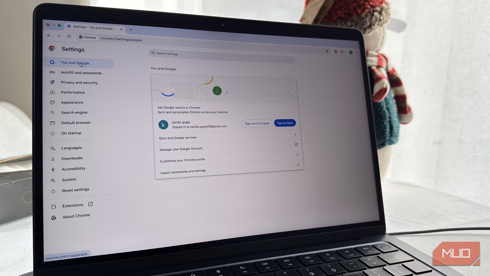 Laptop showing Chrome settings page with performance options open