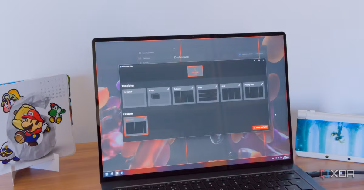 Laptop showing PowerToys FancyZones editor with custom layout templates on screen