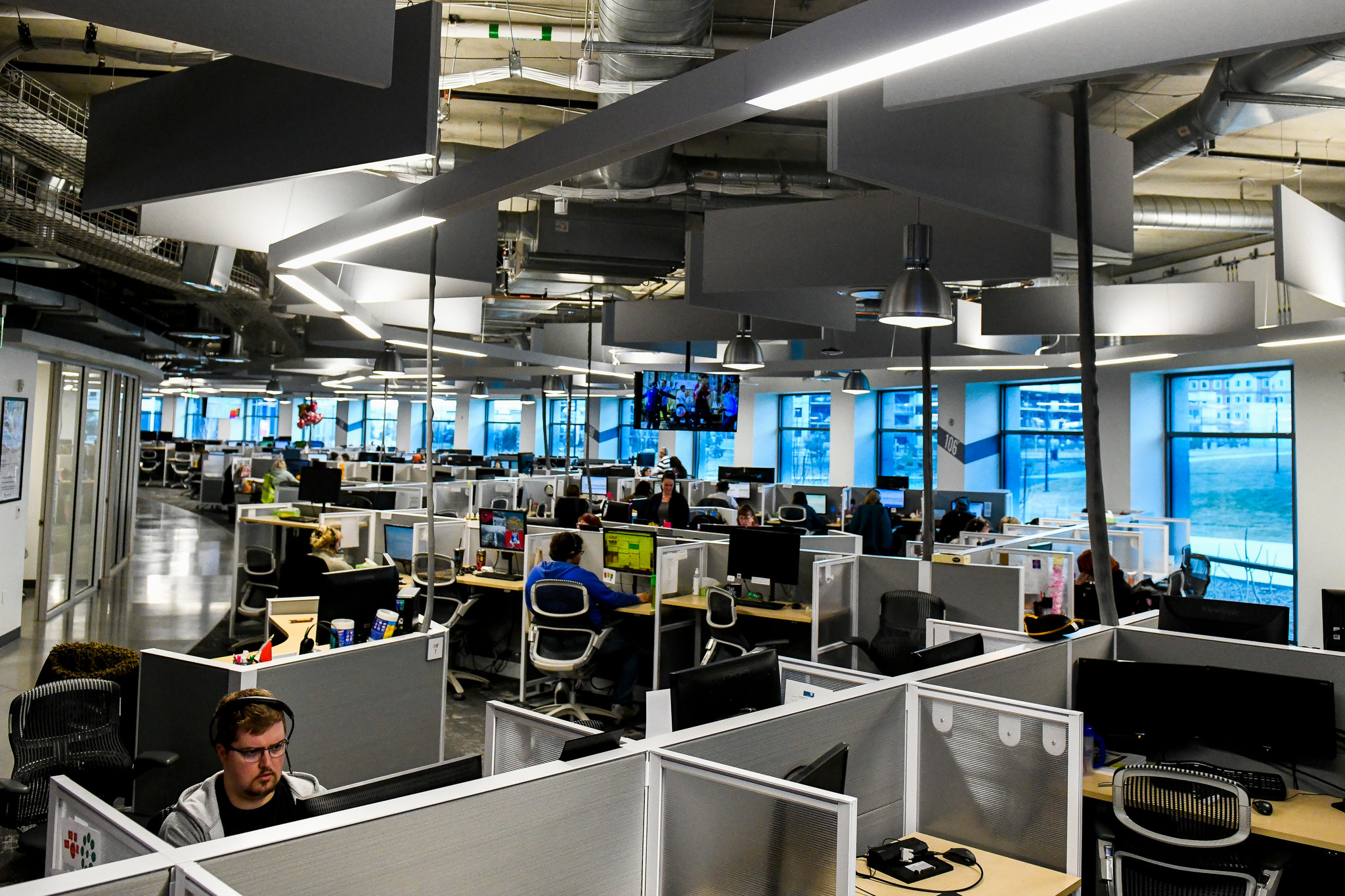Modern AI research laboratory interior with computer workstations