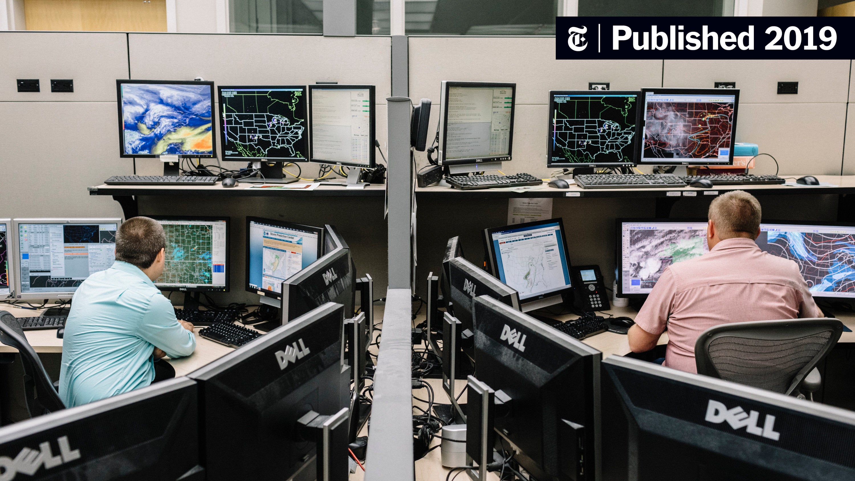 Storm Prediction Center meteorologists monitoring weather data on multiple screens