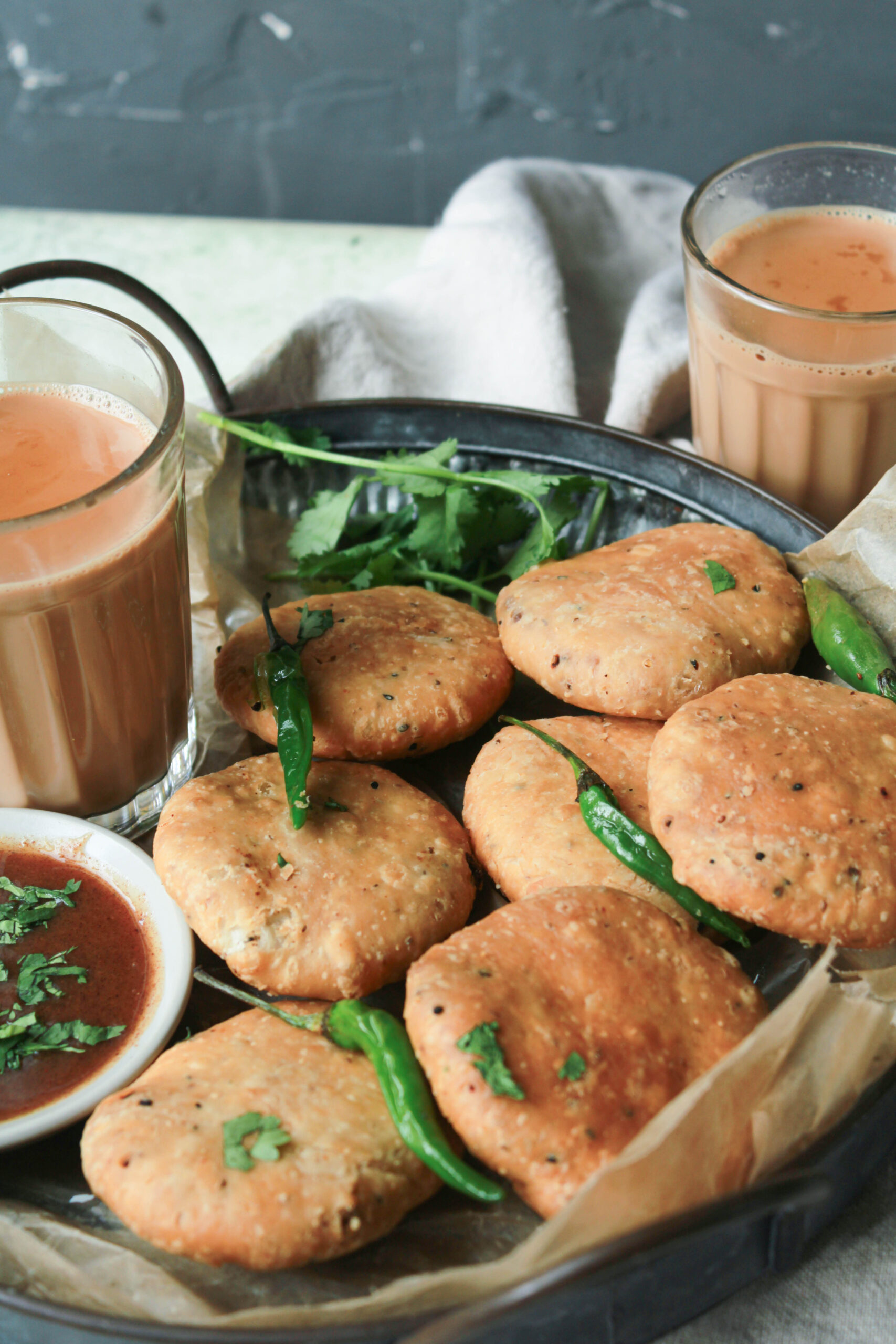 Jaipur famous pyaaz kachori served with green chilies and chutney at Rawat Mishthan Bhandar