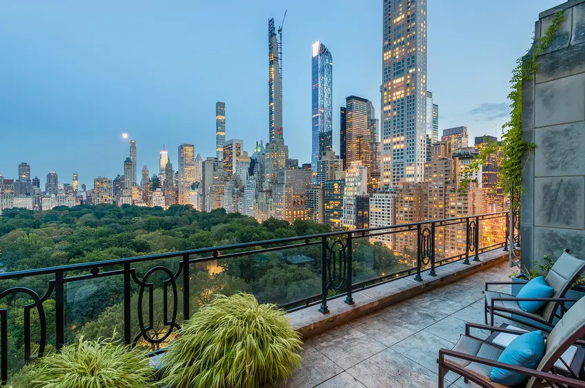 Luxury high-rise residential tower with city skyline vista