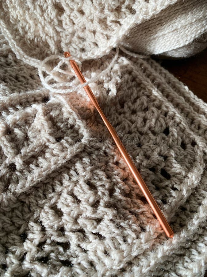 Yarn Art, Fiber Art, Crochet Hook with Stitches and Skein of Yarn