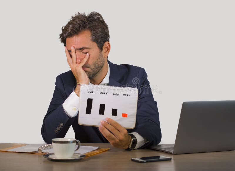 Frustrated business owner looking at declining sales chart