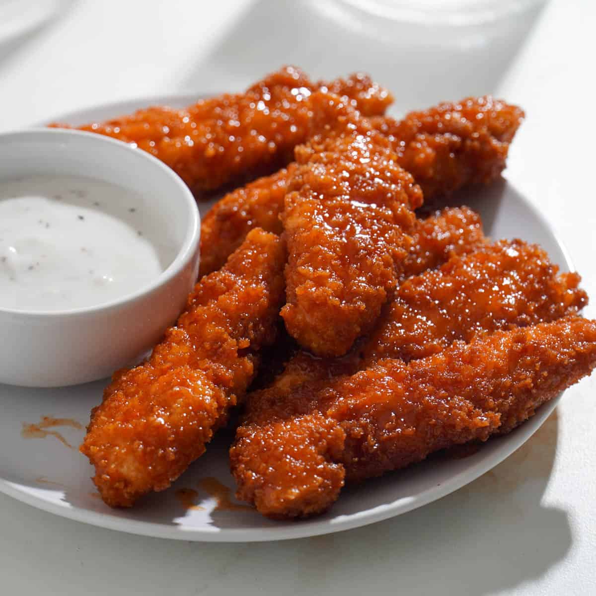 Crispy hot honey chicken tenders with ranch dipping sauce sweet spicy